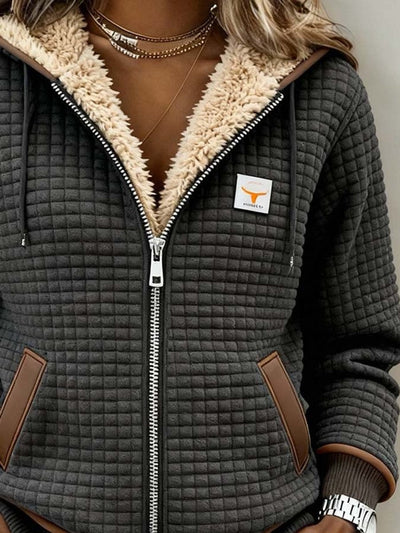 NEVIK | Veste à capuche zippée en sherpa matelassé
