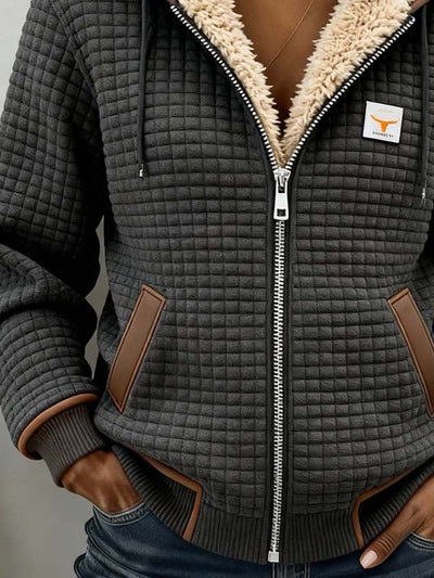 NEVIK | Veste à capuche zippée en sherpa matelassé